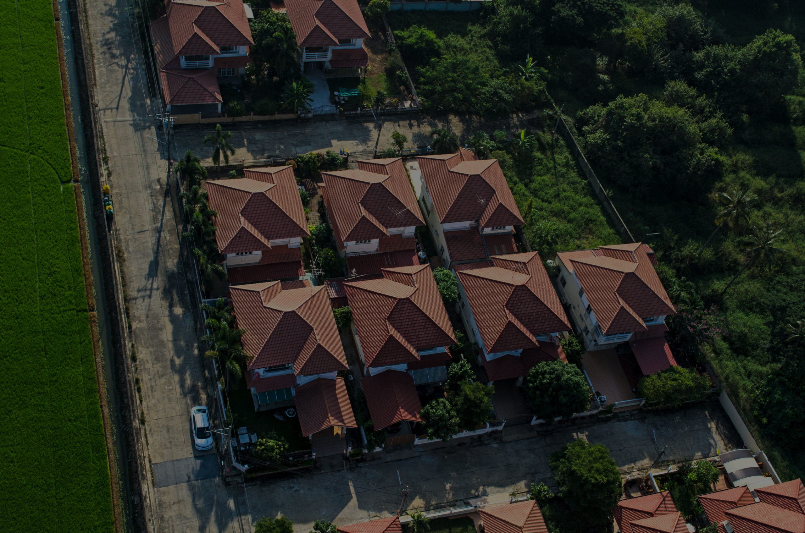 Red roofs in residential area housing, view from the air